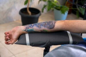 Blue Wave Tattoo Print on Forearm